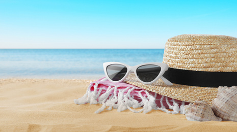Image of Beach objects on sand near sea, space for text. Summer vacation 
