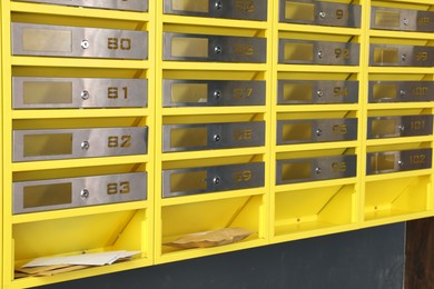 Photo of Metal mailboxes with keyholes, numbers and correspondence in post office