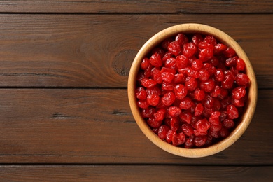 Photo of Bowl of sweet cherries on table, top view with space for text. Dried fruit as healthy snack
