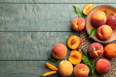 Photo of Fresh sweet peaches on wooden table, flat lay. Space for text