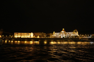 Photo of BUDAPEST, HUNGARY - APRIL 27, 2019: Beautiful night cityscape with illuminated Danubius Hotel Gellert