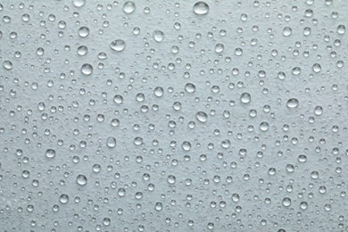 Photo of Water drops on white background, top view