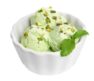 Photo of Bowl of sweet pistachio ice cream with mint on white background