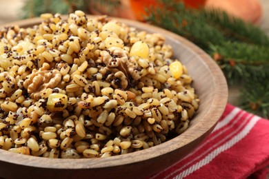 Photo of Traditional Christmas slavic dish kutia in bowl, closeup