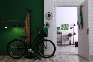 Photo of Stylish hallway with modern bicycle. Idea for interior decor