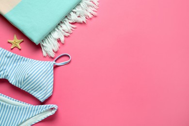 Photo of Flat lay composition with different beach objects on pink background, space for text