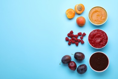 Photo of Different puree in bowls and fresh ingredients on light blue background, flat lay. Space for text