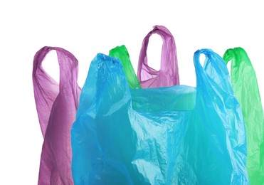 Photo of Many different plastic bags on white background