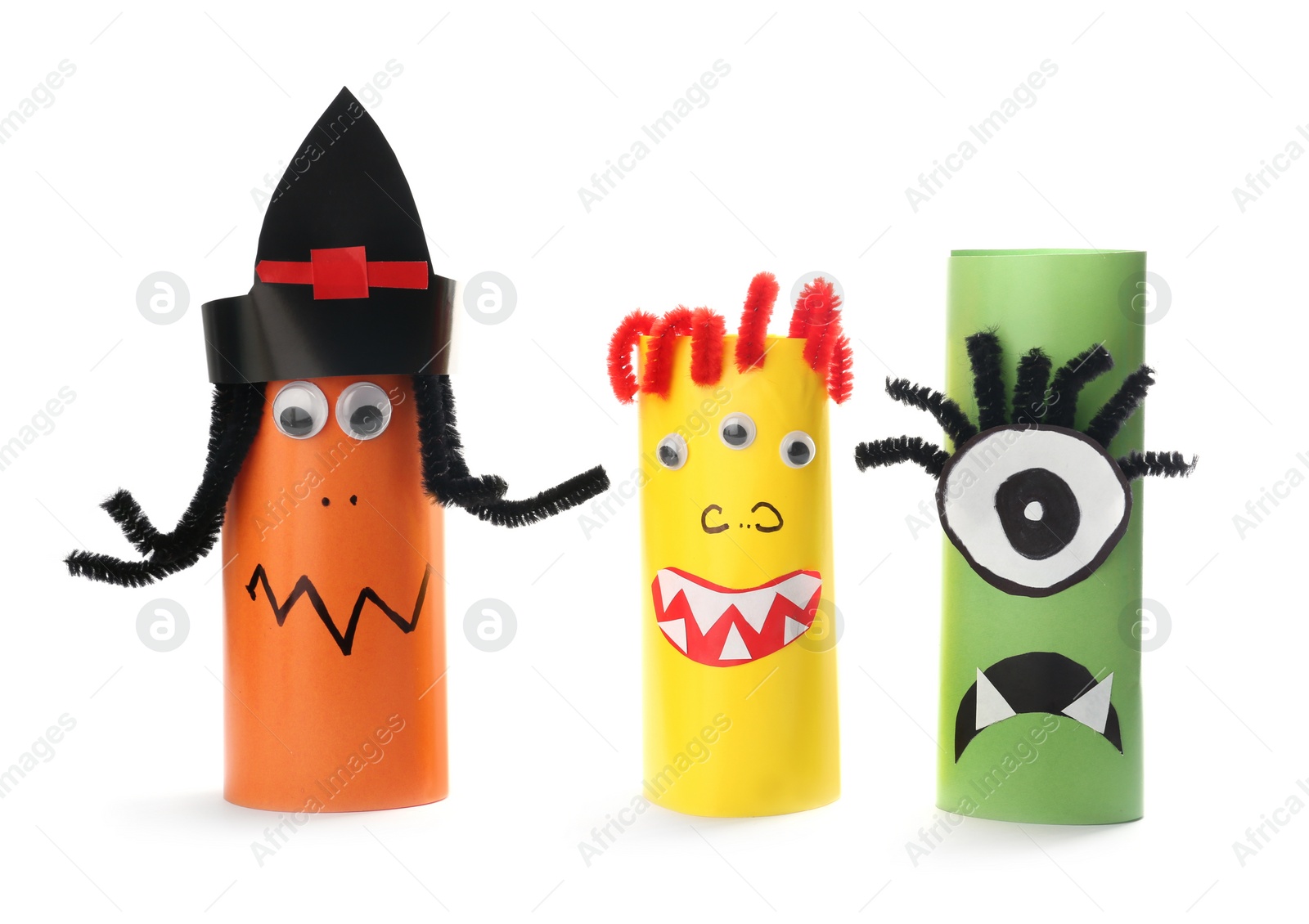 Photo of Funny monsters on white background. Halloween decoration
