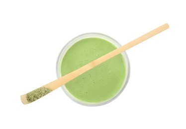 Photo of Glass of tasty matcha smoothie and bamboo spoon with powder isolated on white, top view