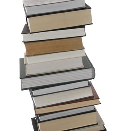 Stack of many different books isolated on white