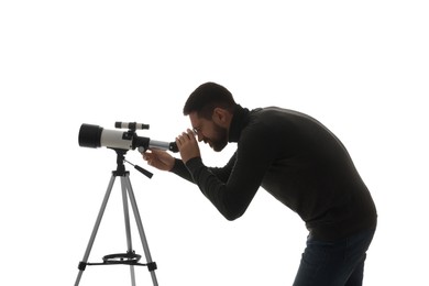 Photo of Astronomer looking at stars through telescope on white background