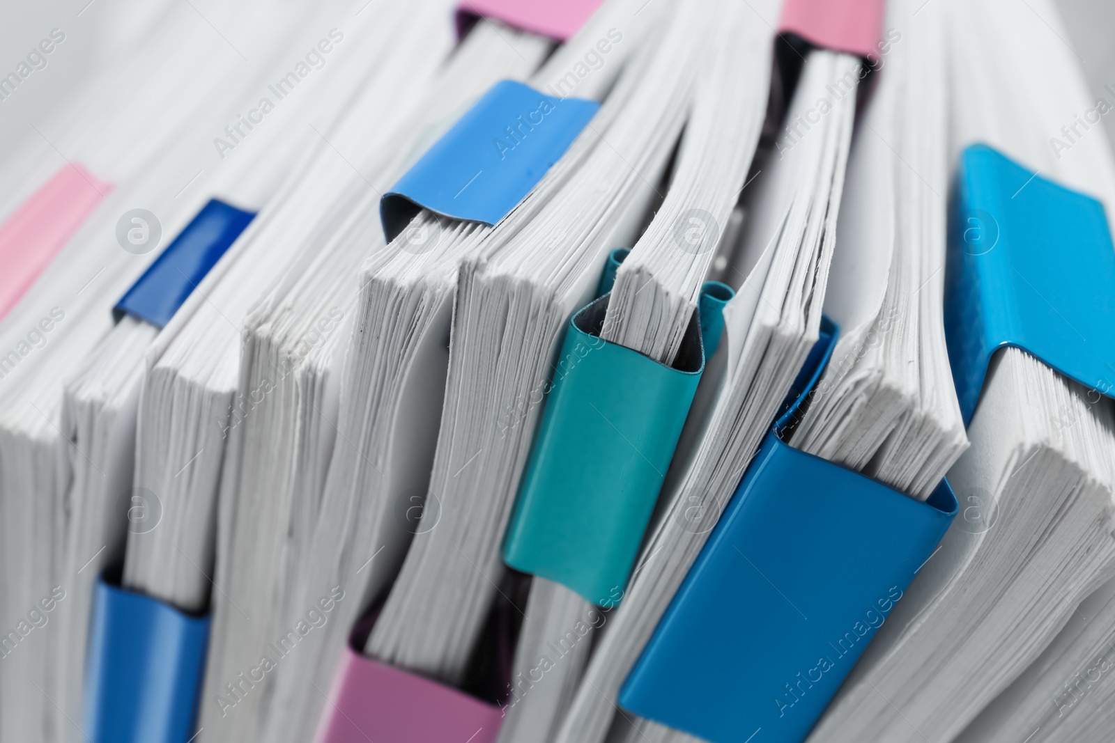 Photo of Pile of documents with binder clips, closeup