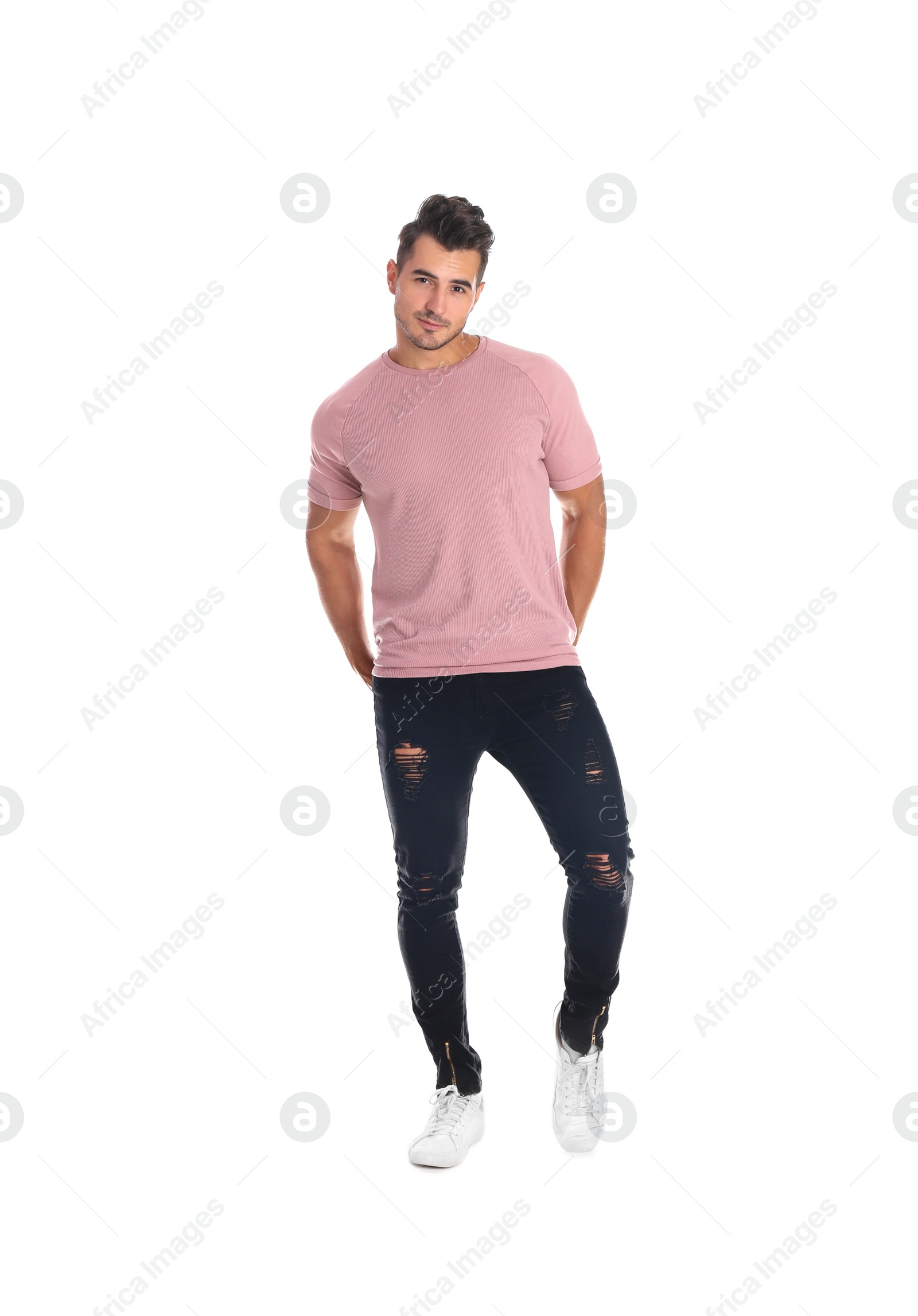 Photo of Young man in stylish jeans on white background