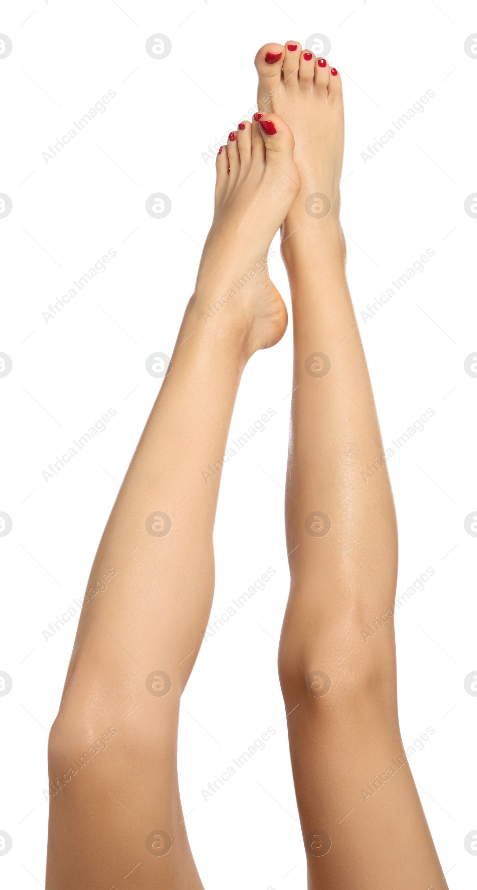 Photo of Woman with stylish red toenails after pedicure procedure isolated on white, closeup