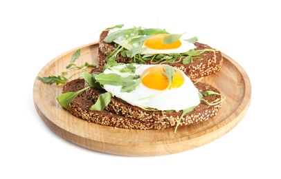 Photo of Delicious sandwiches with arugula and fried egg isolated on white