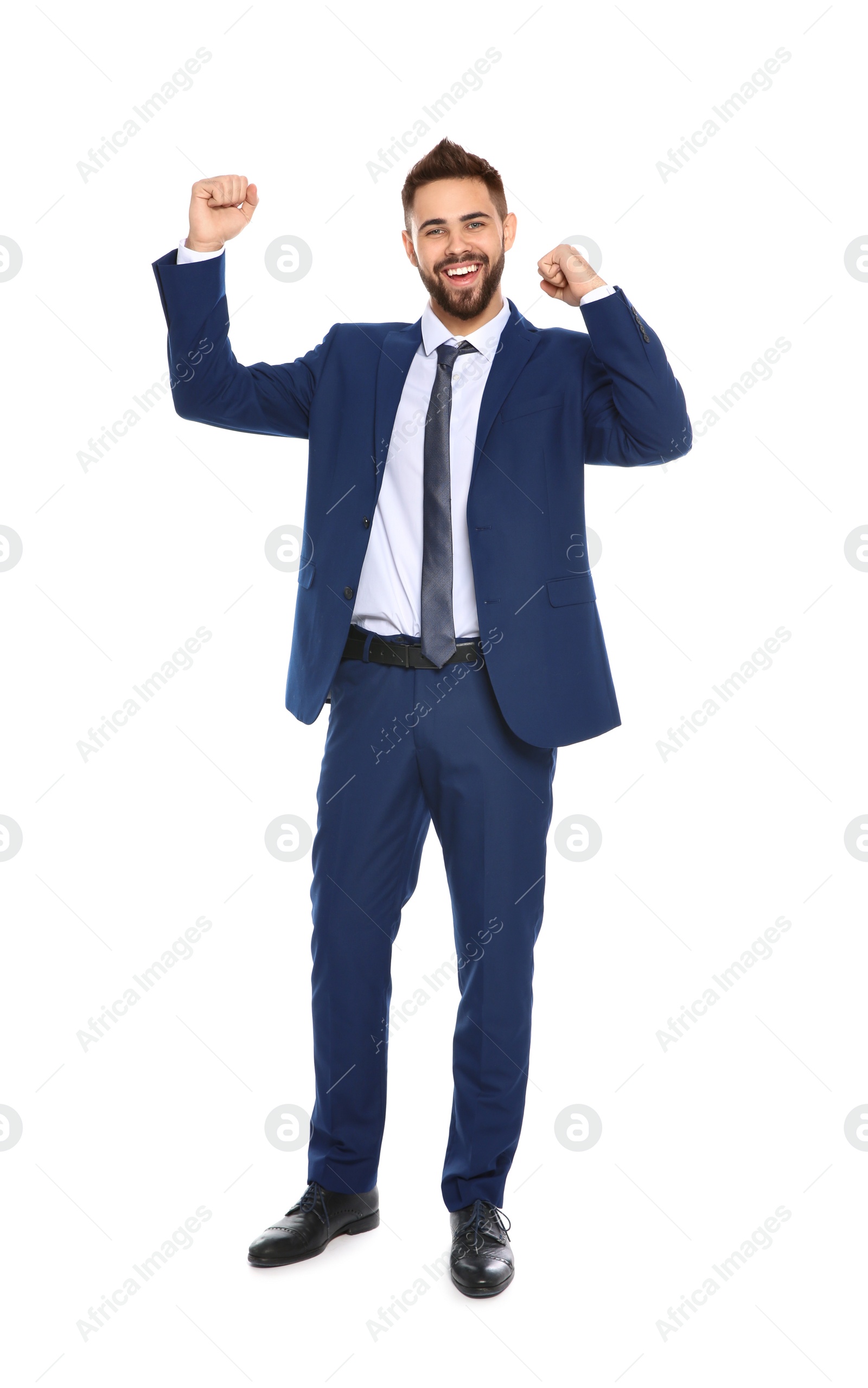 Photo of Happy young businessman celebrating victory on white background