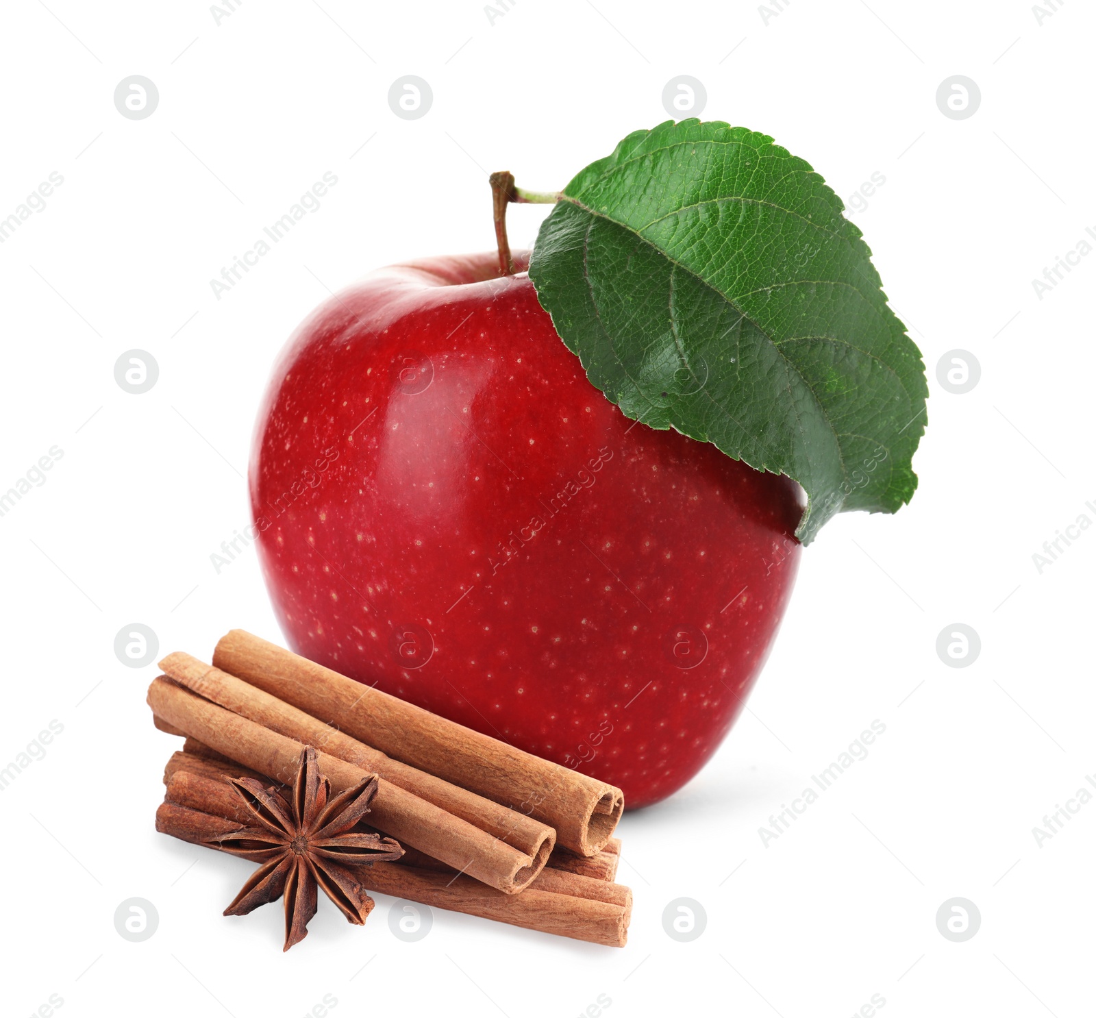 Image of Aromatic cinnamon sticks, anise star and red apple isolated on white