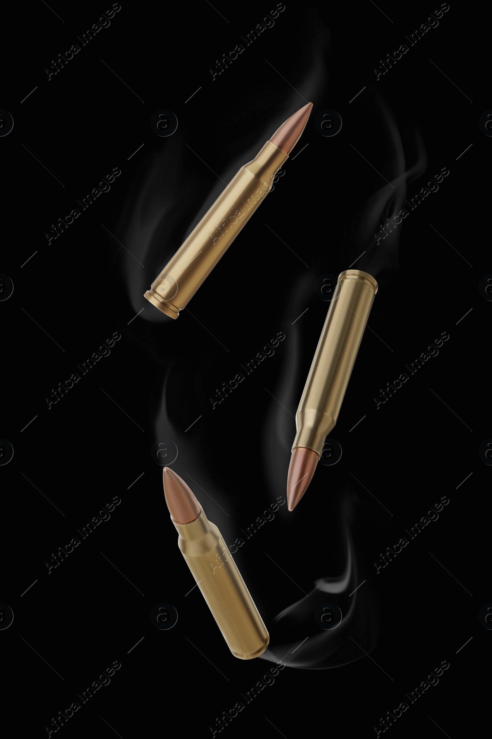 Image of Bullets with smoke falling on black background