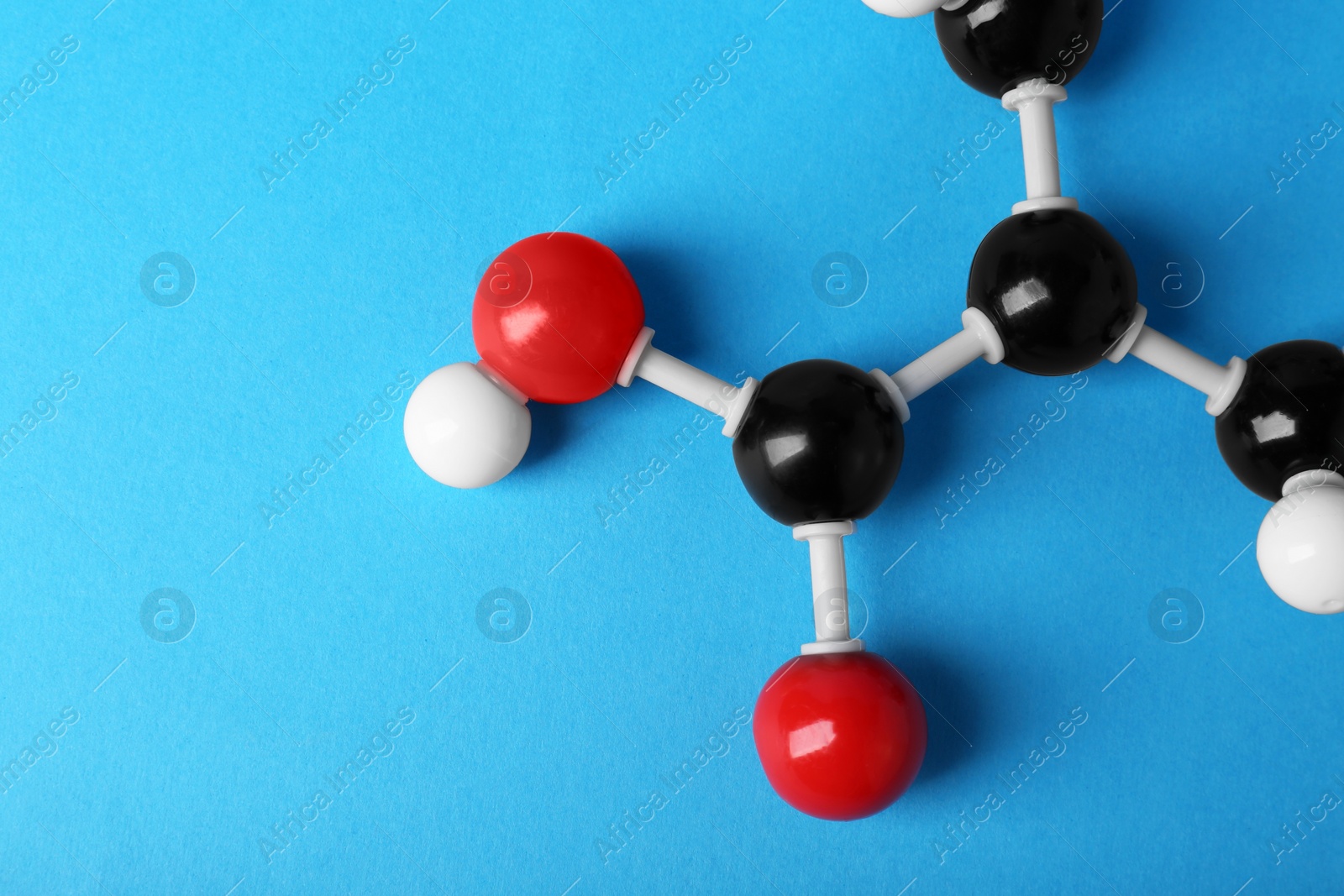 Photo of Molecule of vitamin B3 on light blue background, top view with space for text. Chemical model