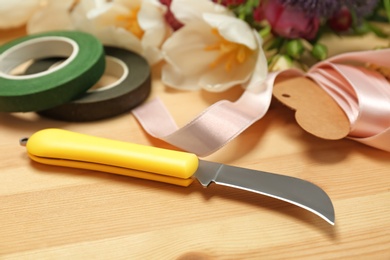 Florist workplace with knife on table