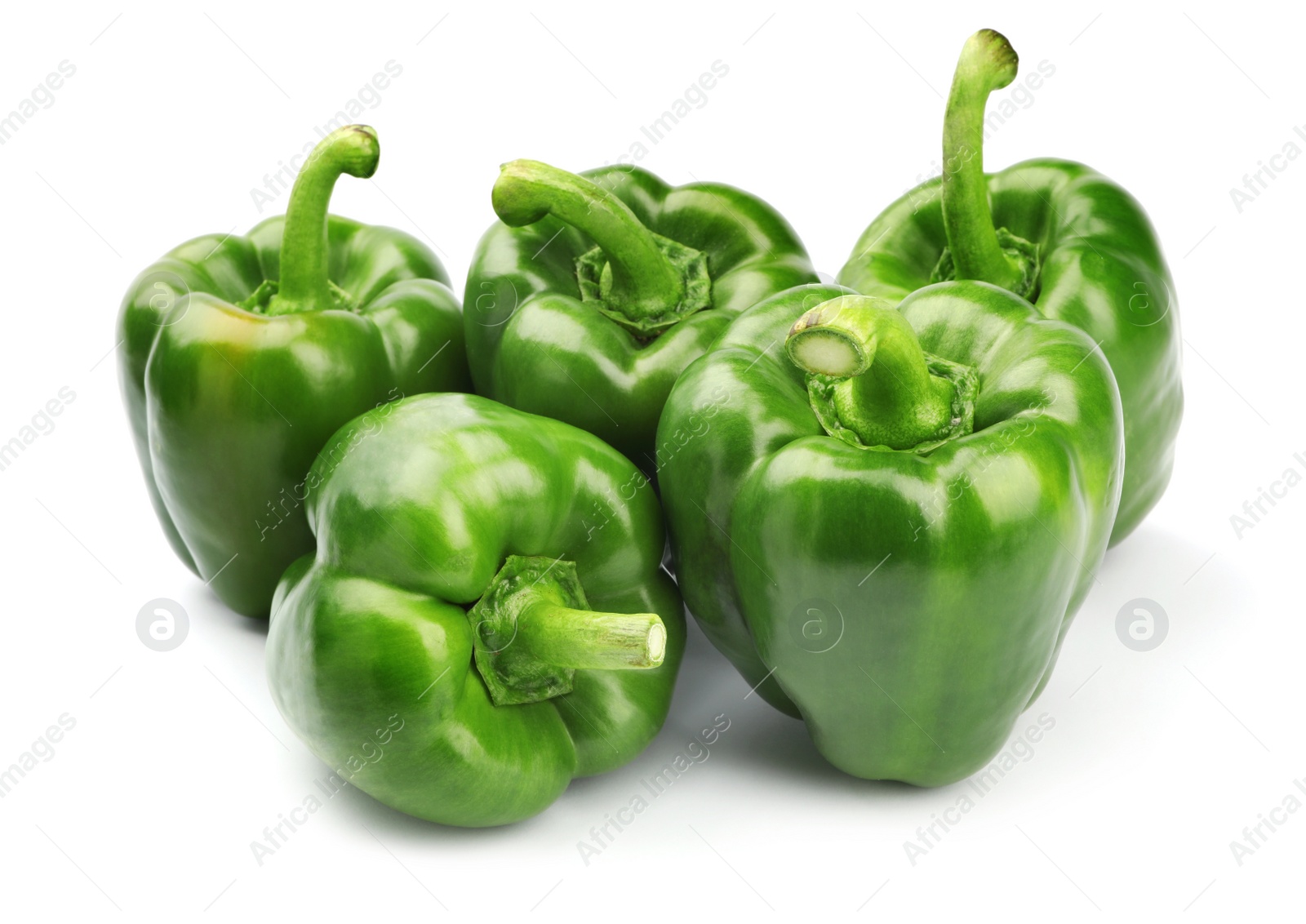 Photo of Pile of tasty green bell peppers on white background