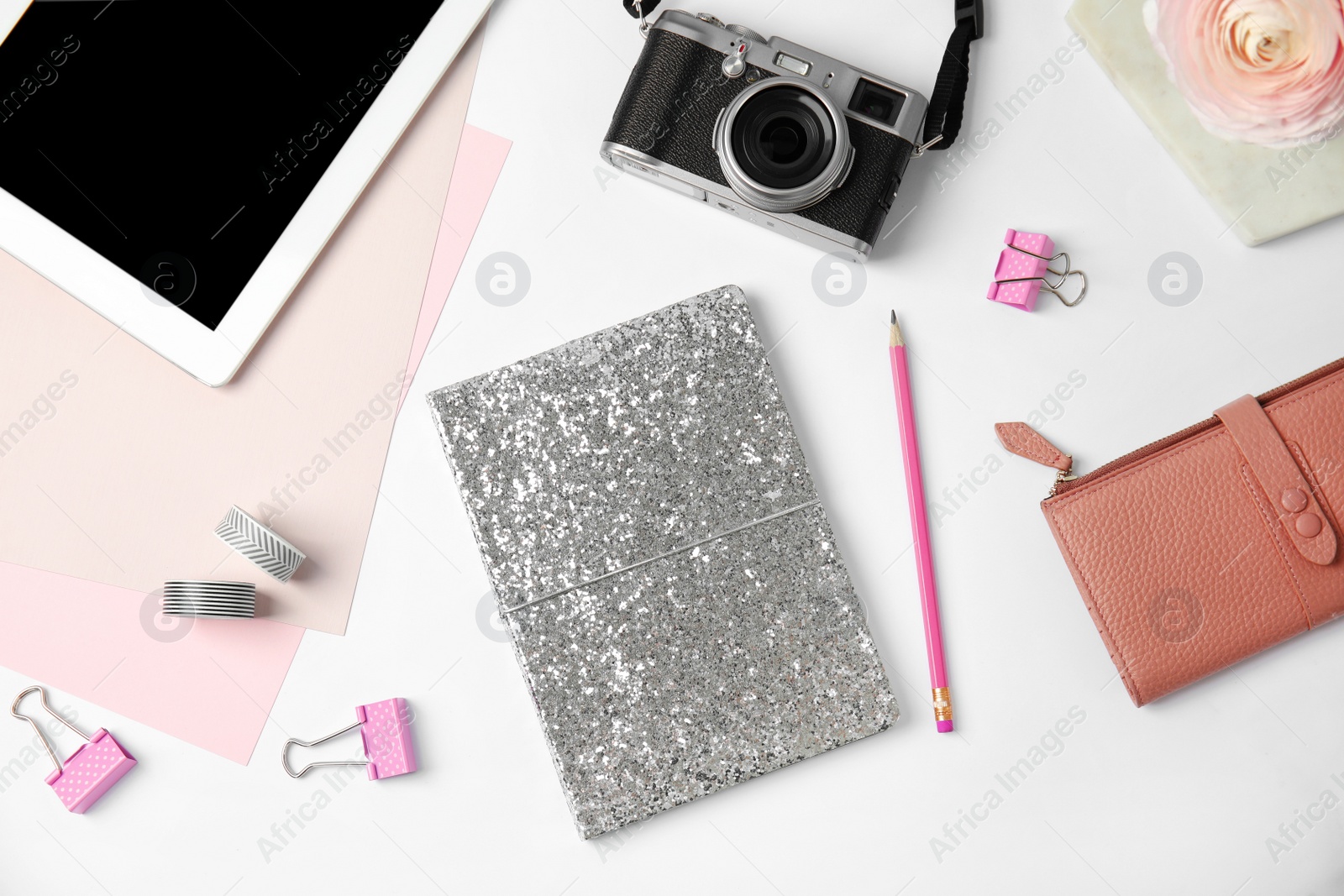 Photo of Blogger's workplace with notebook, tablet and camera on white background, flat lay