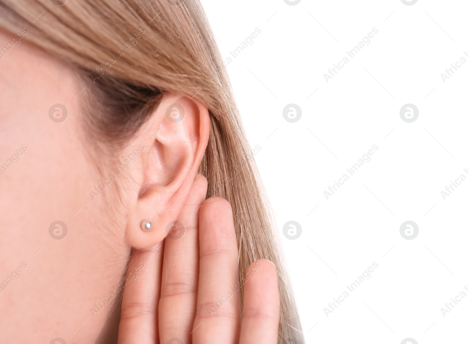 Photo of Young woman with hearing problem on white background, closeup