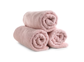 Photo of Rolled soft terry towels on white background