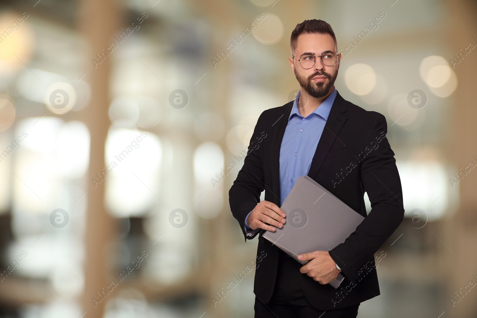 Image of Successful lawyer with laptop on blurred background, space for text