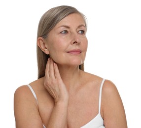 Beautiful woman touching her neck on white background