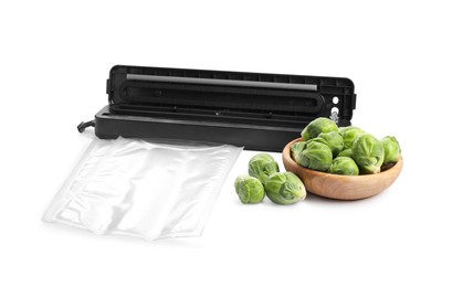 Photo of Sealer for vacuum packing, plastic bag and fresh Brussels sprouts on white background