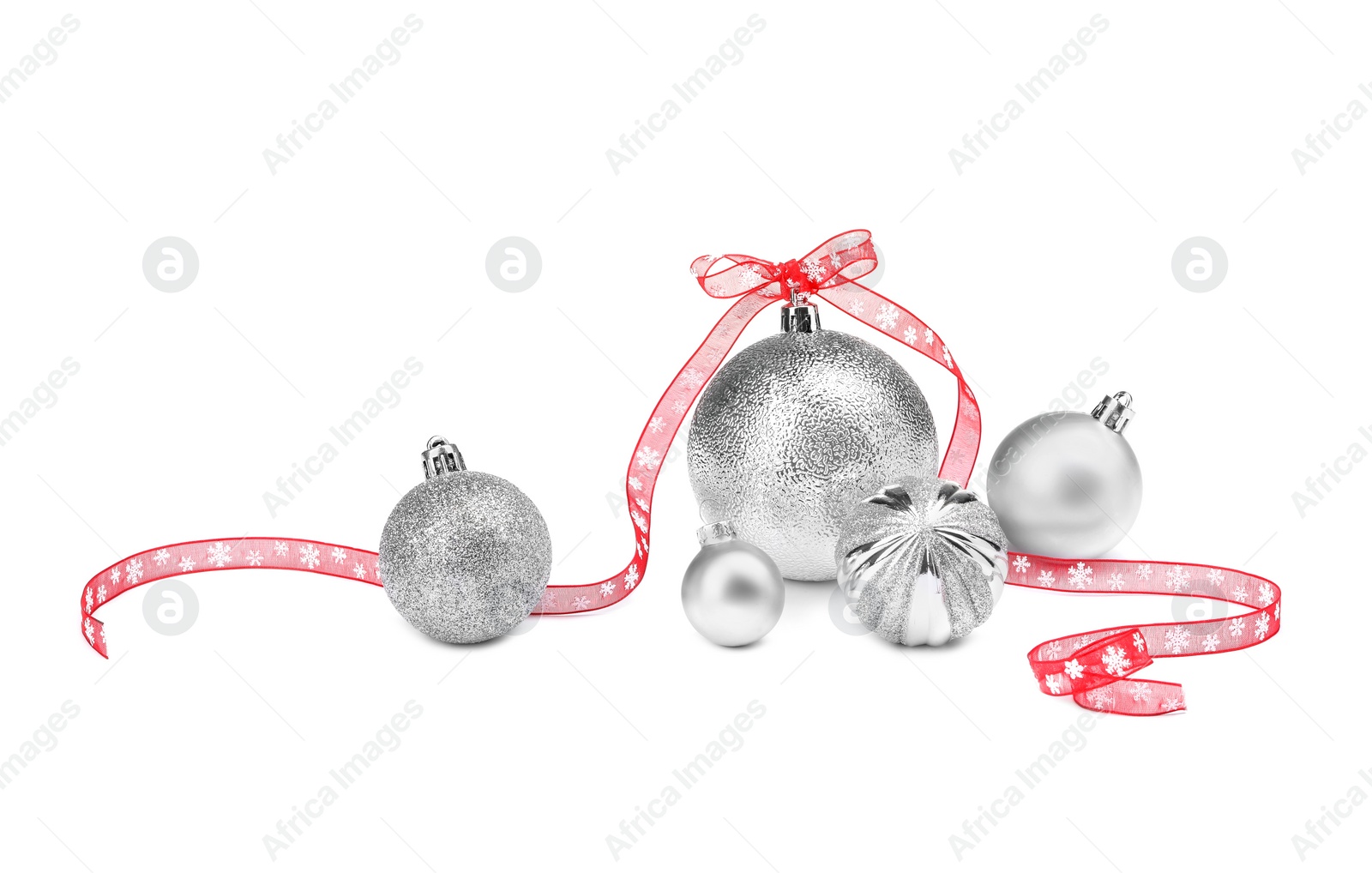 Photo of Beautiful Christmas balls and red ribbon isolated on white