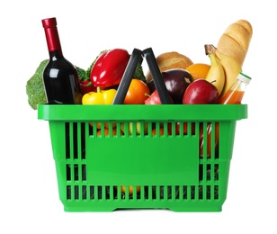 Shopping basket with grocery products on white background