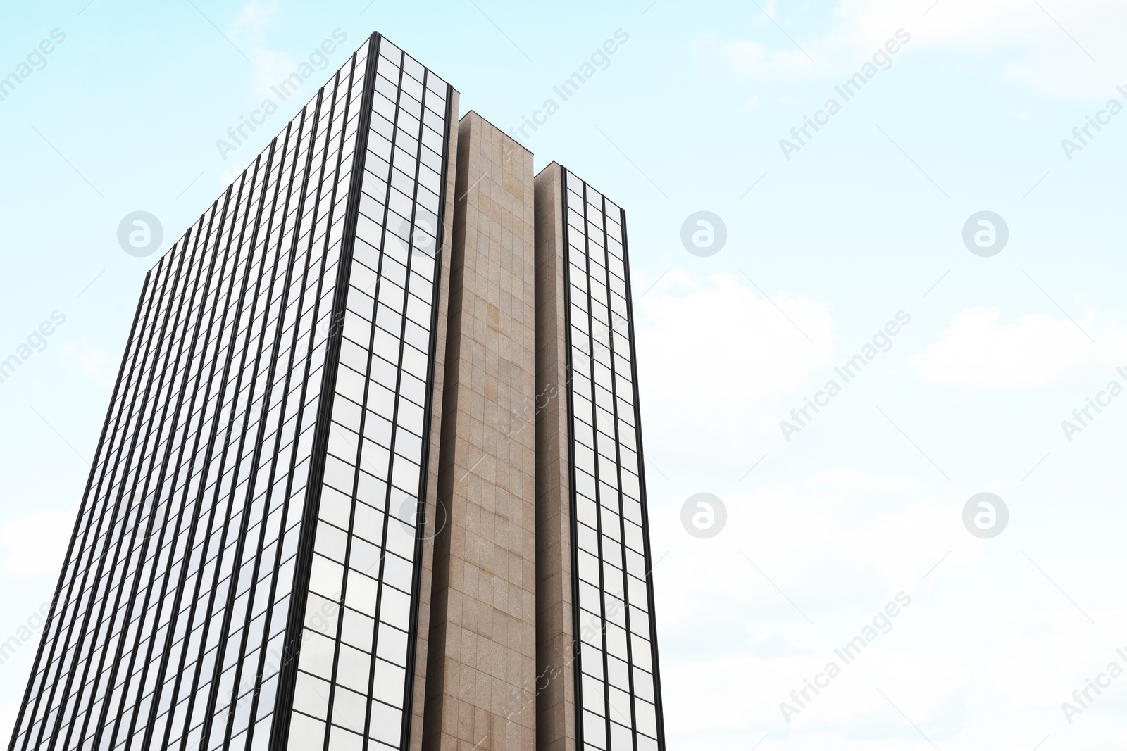 Photo of Beautiful view of skyscraper with big windows against sky