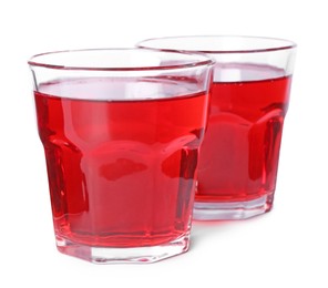 Photo of Tasty cranberry juice in glasses isolated on white