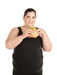 Photo of Overweight woman with hamburger on white background