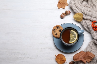 Photo of Flat lay composition with hot drink on white wooden background, space for text. Cozy autumn