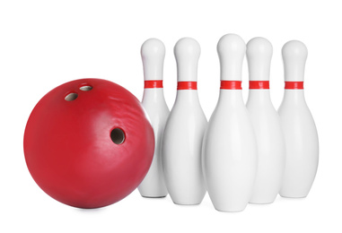 Photo of Red bowling ball and pins isolated on white