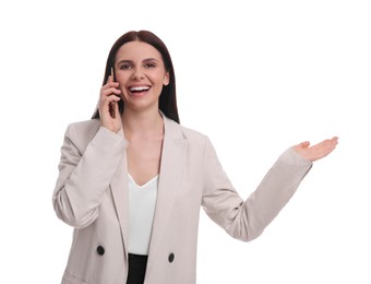 Beautiful businesswoman in suit talking on smartphone against white background