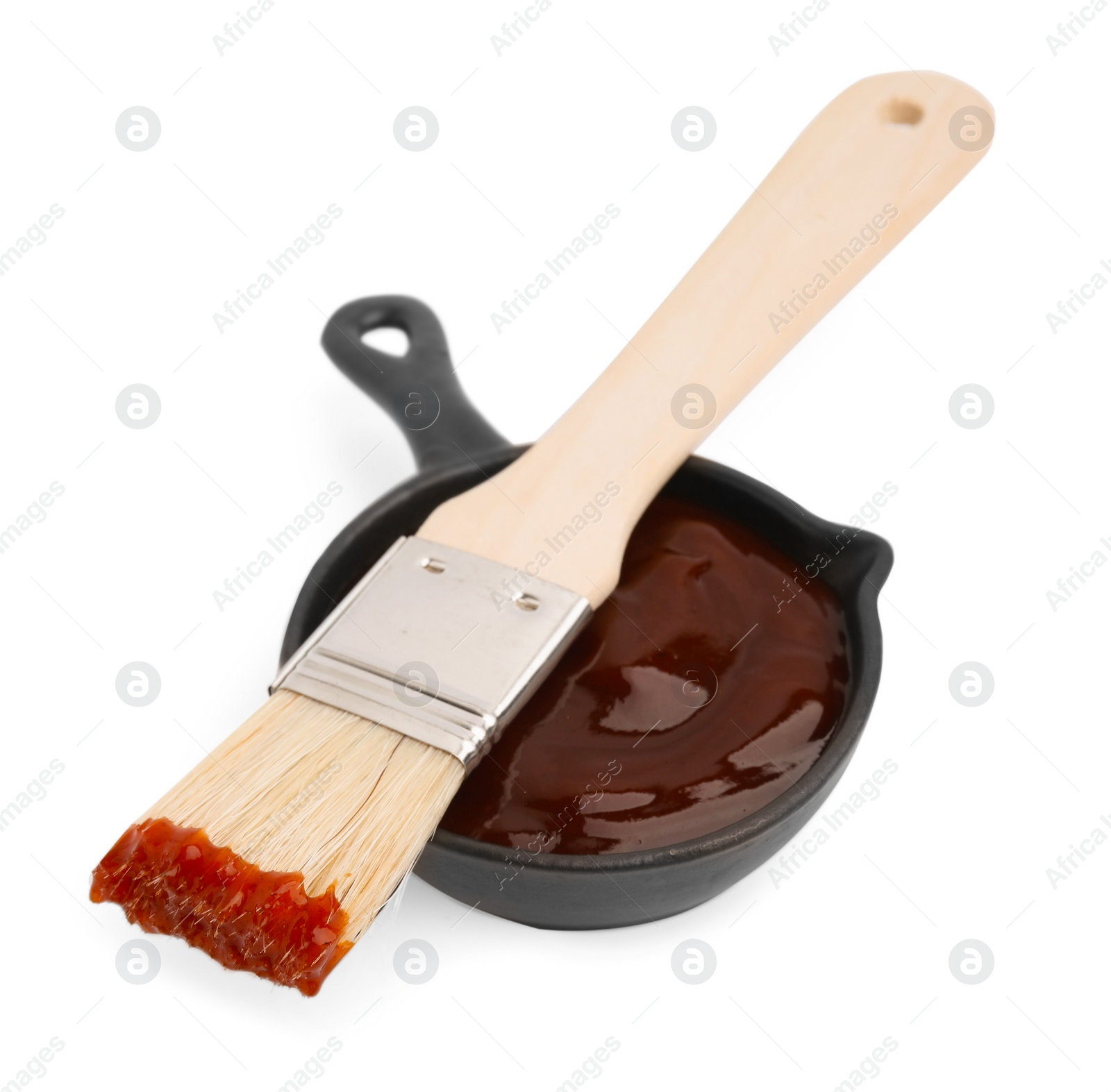 Photo of Marinade in gravy boat and basting brush isolated on white