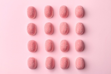 Sweet jelly candies on pink background, flat lay