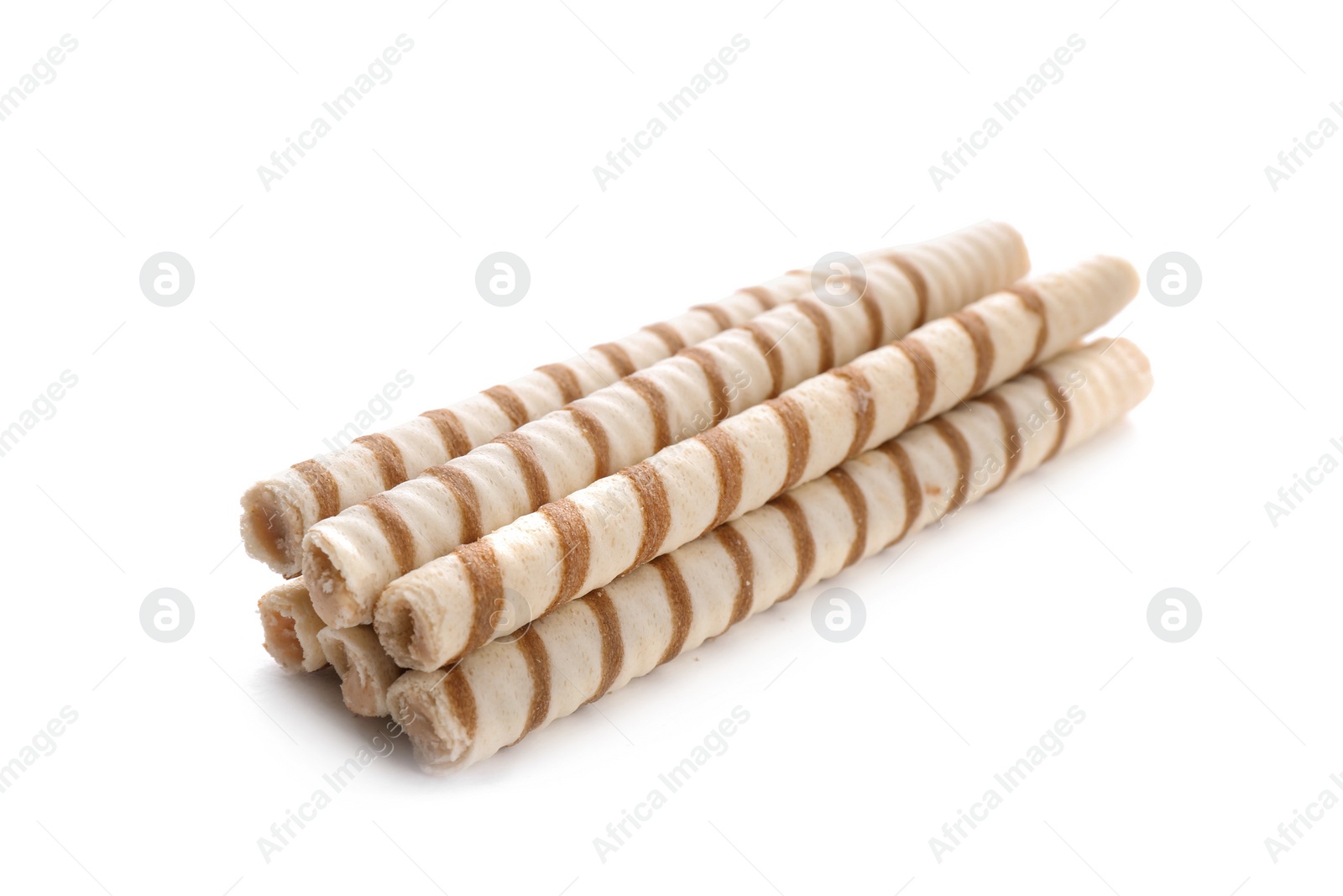 Photo of Tasty wafer roll sticks on white background. Crispy food