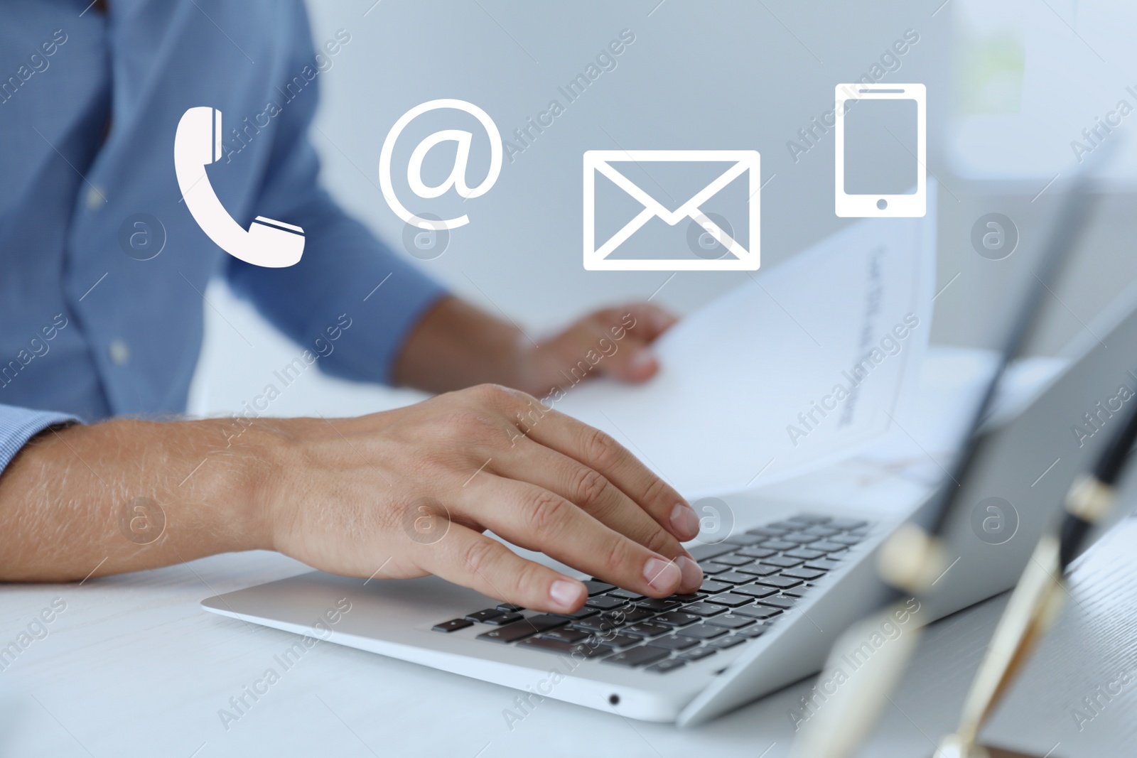 Image of Hotline service. Man working on laptop at table, closeup