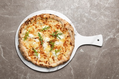 Image of Tasty cheese pizza on grey marble table, top view