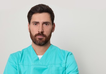 Nurse in medical uniform on white background