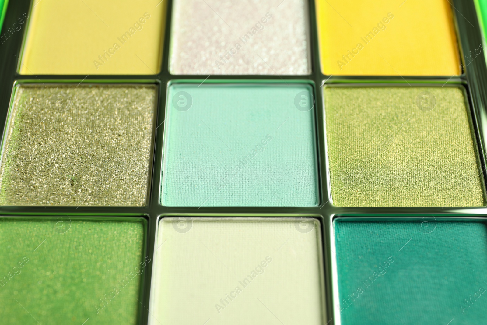 Photo of Beautiful palette of colorful eyeshadows as background, closeup