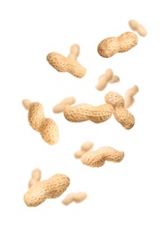 Image of Unpeeled peanuts in air on white background