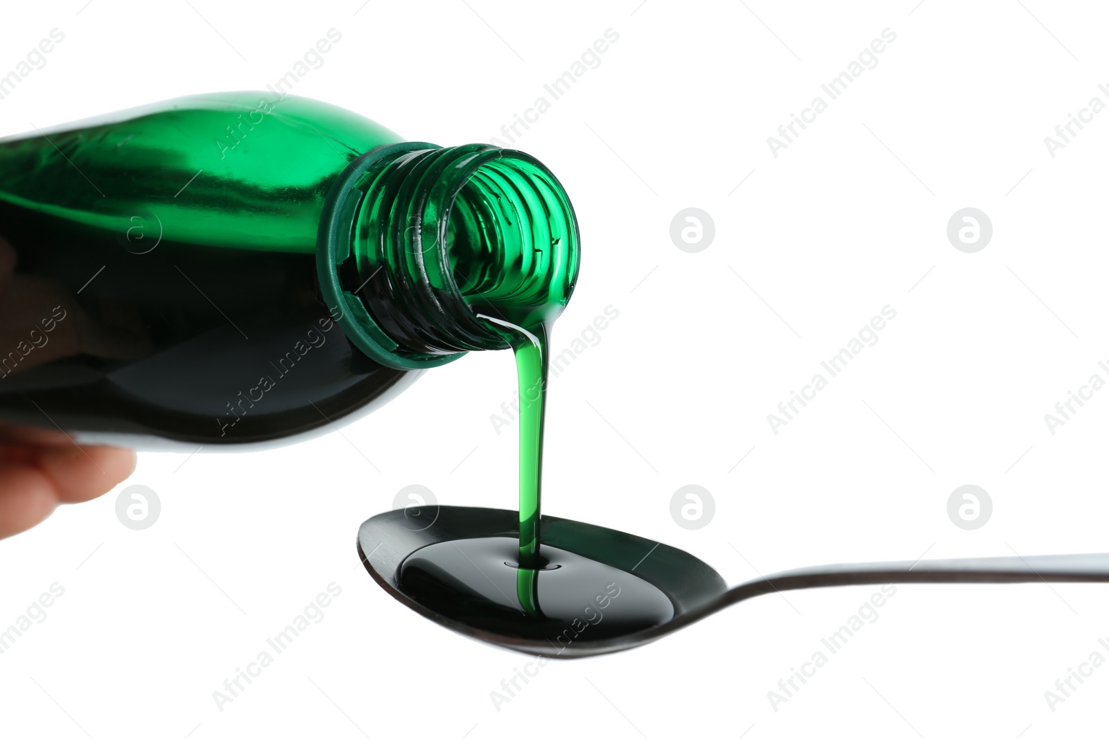 Photo of Pouring cough syrup into spoon on white background