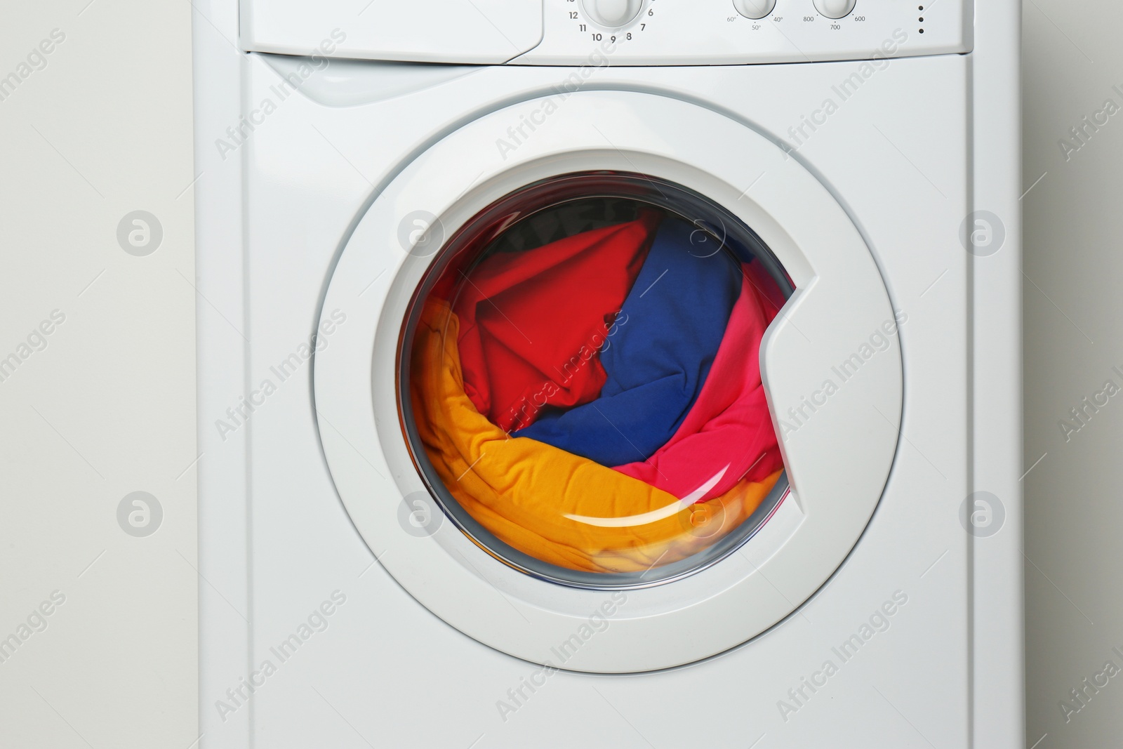 Photo of Modern washing machine on white background. Laundry day